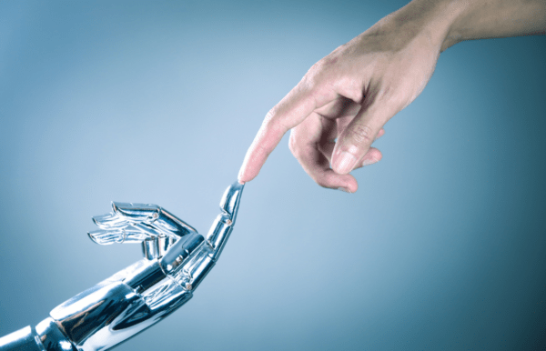 Machine Hand and Human Hand reaching out to each other